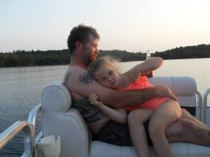 Moxie and her Daddy out on the lake at camp
